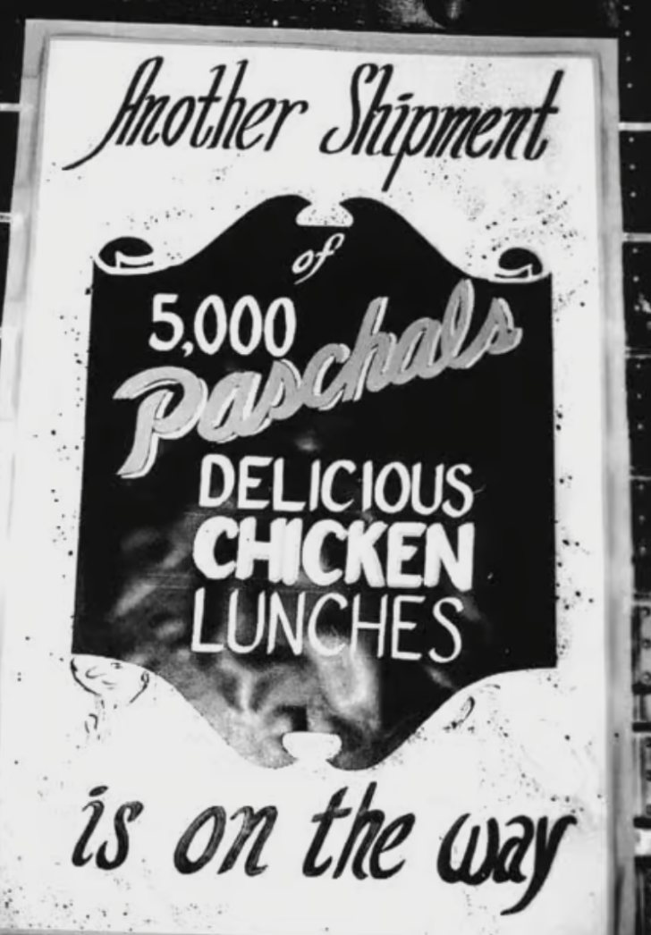Hand-painted Paschal's sign reading: Another shipment of 5,000 Paschal's delicious chicken lunches is on the way